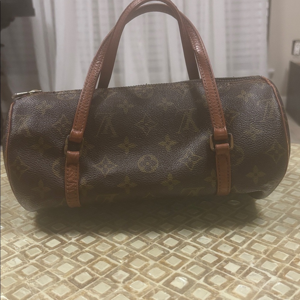 Vintage Louis Vuitton roll bag with Tan Leather Handles. Small